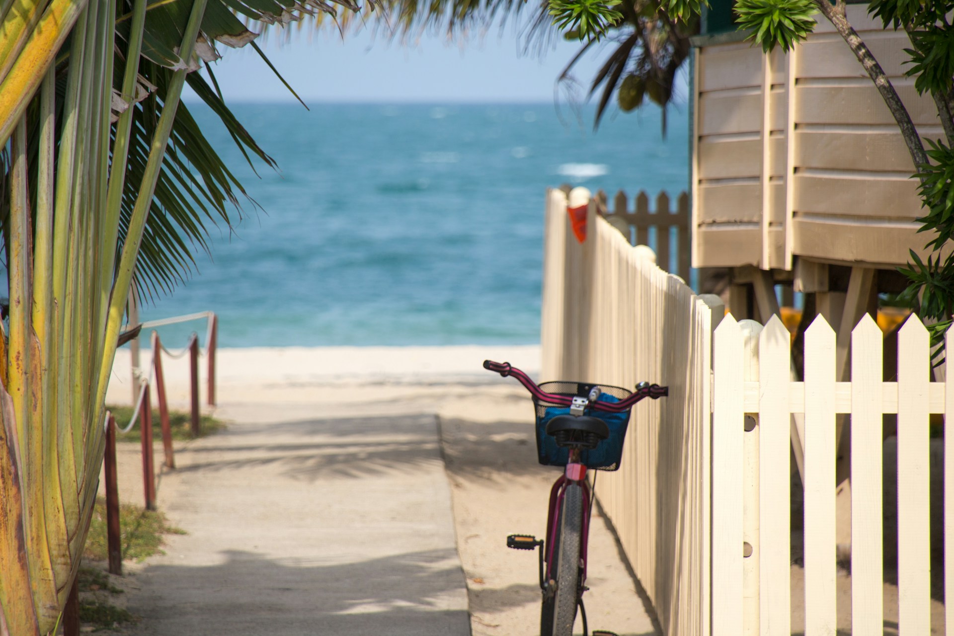 beach bicycle parked against a fence, small towns in Florida