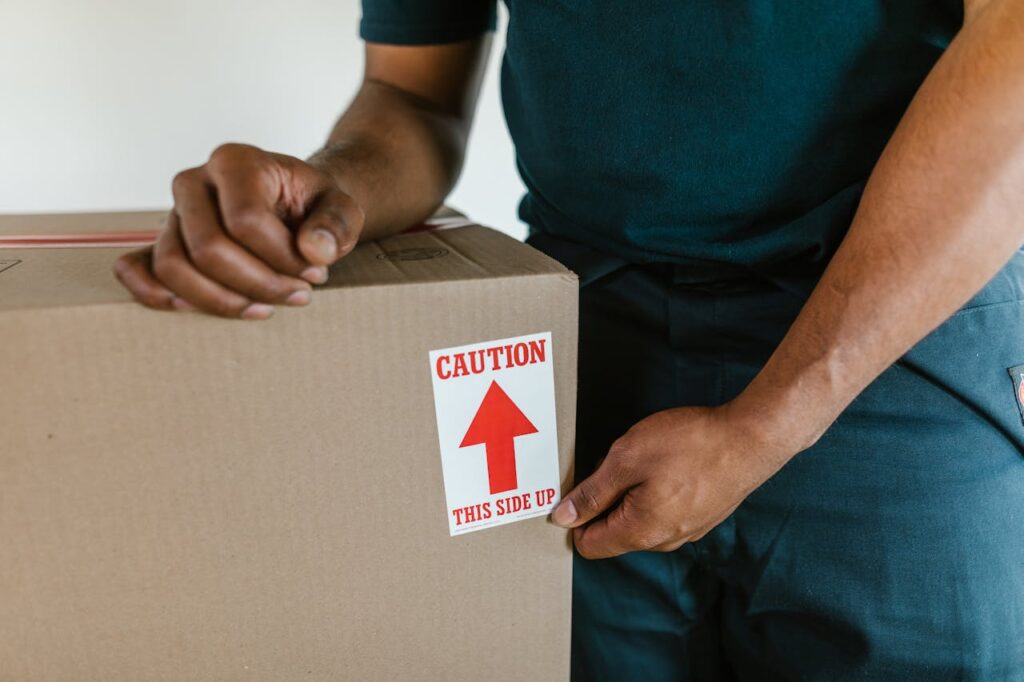 pro mover labeling a box, full service movers